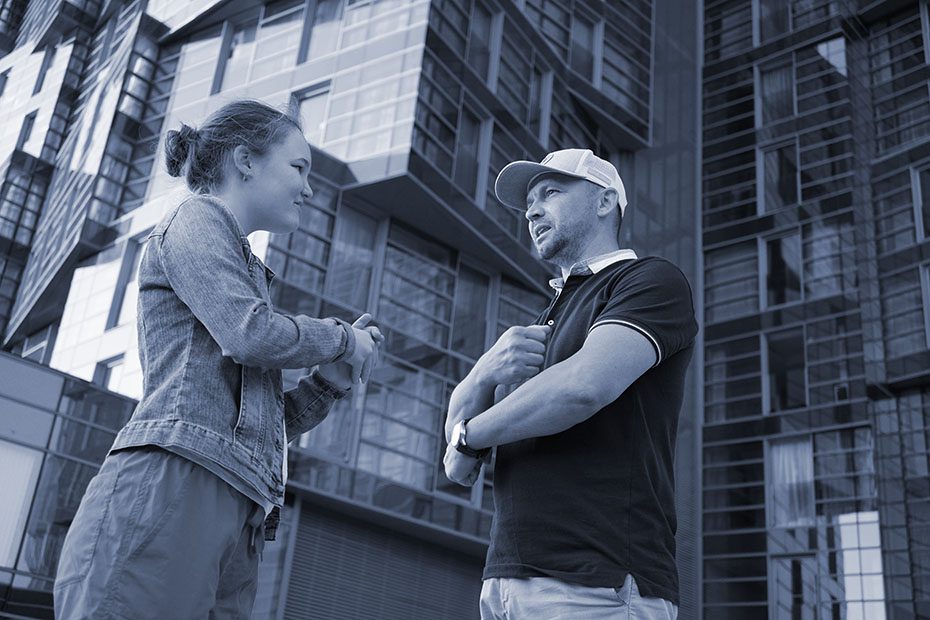 father and daughter have conversation on city street