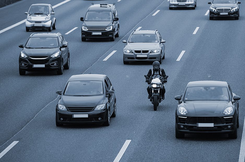 Motorcyclist lane splitting on the freeway