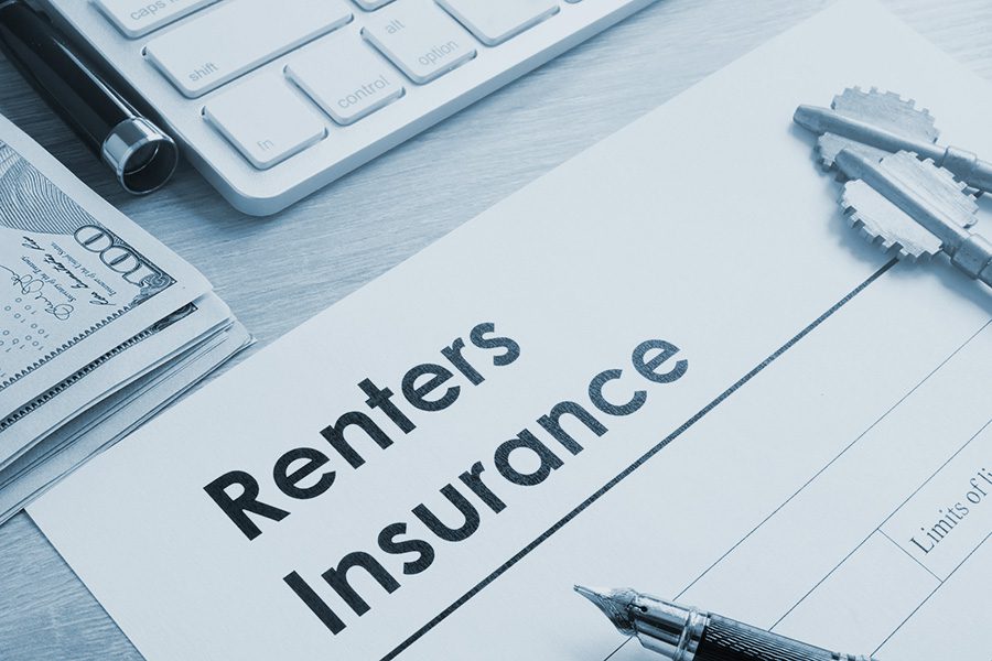 Renters Insurance form on a table and keys.