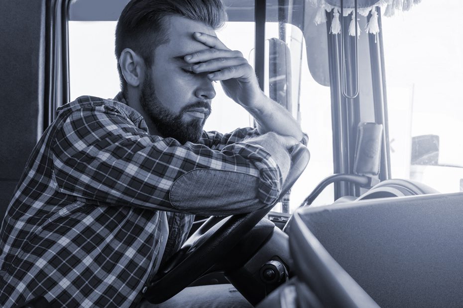 Tired truck driver feeling sleepy and sick