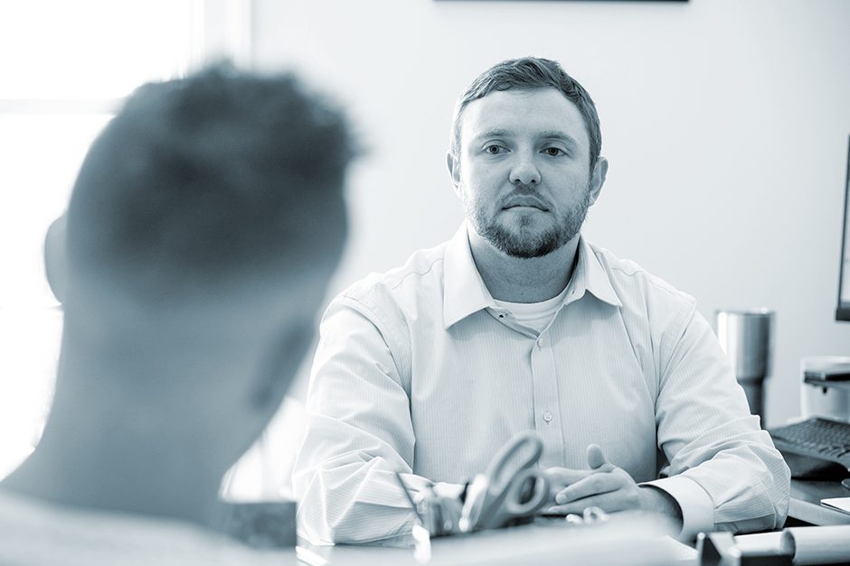 Attorneys listens to client 