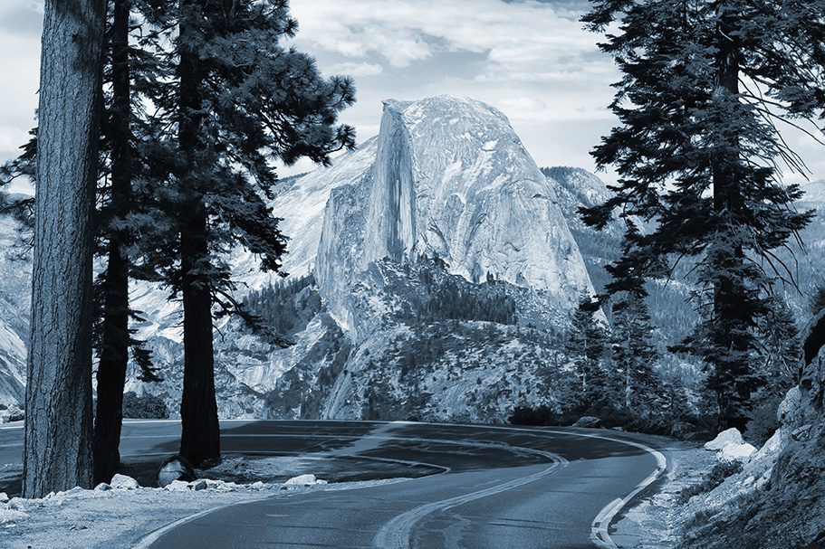 The road leading to Glacier Point in Yosemite National Park, California, USA with the Half Dome in the background.